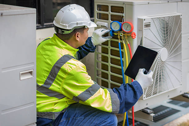 Professional Emergency Ac Repair technician working in Hadley, NY